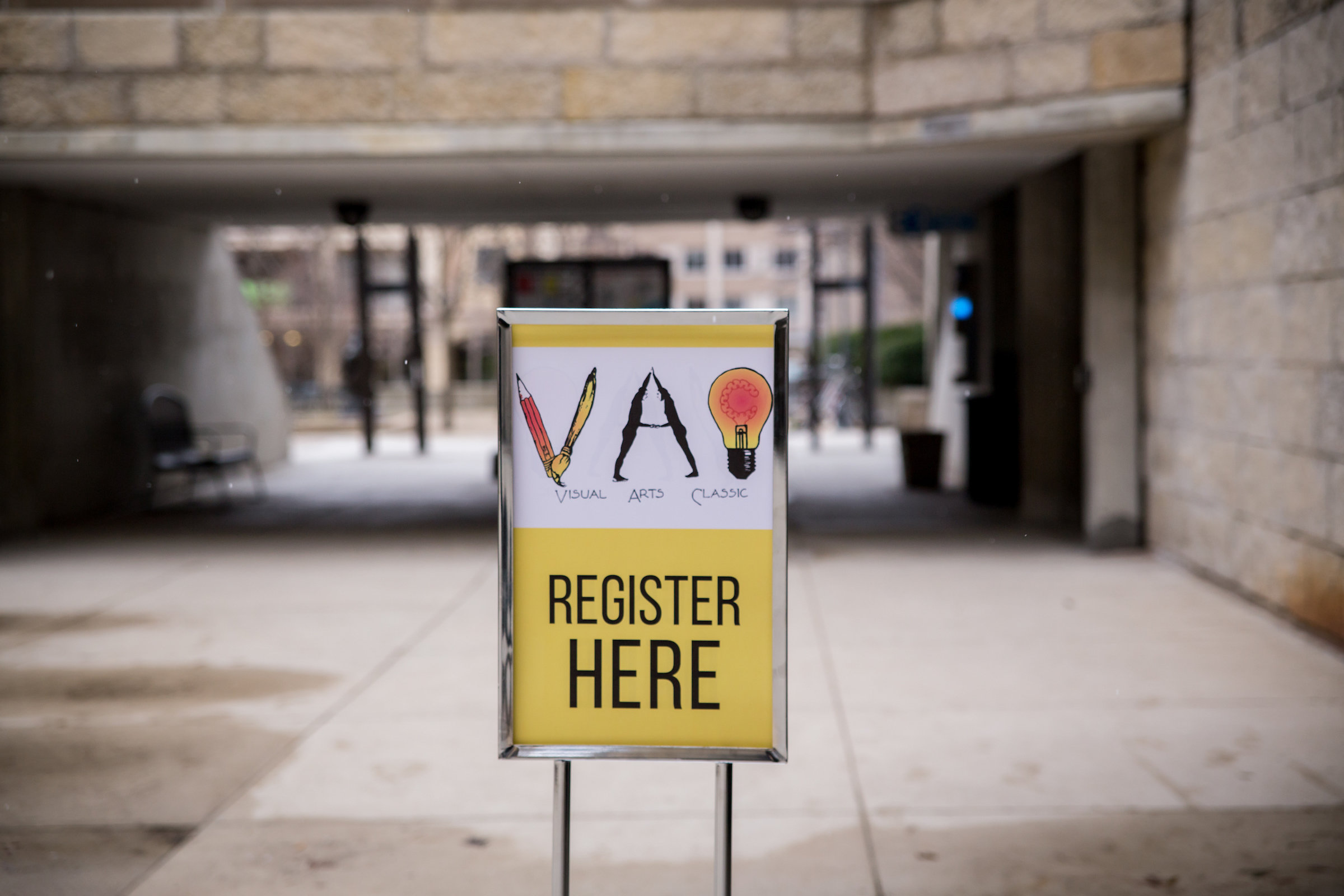 Photo of the VAC Registration sign in the breezeway of the Humanities Building.