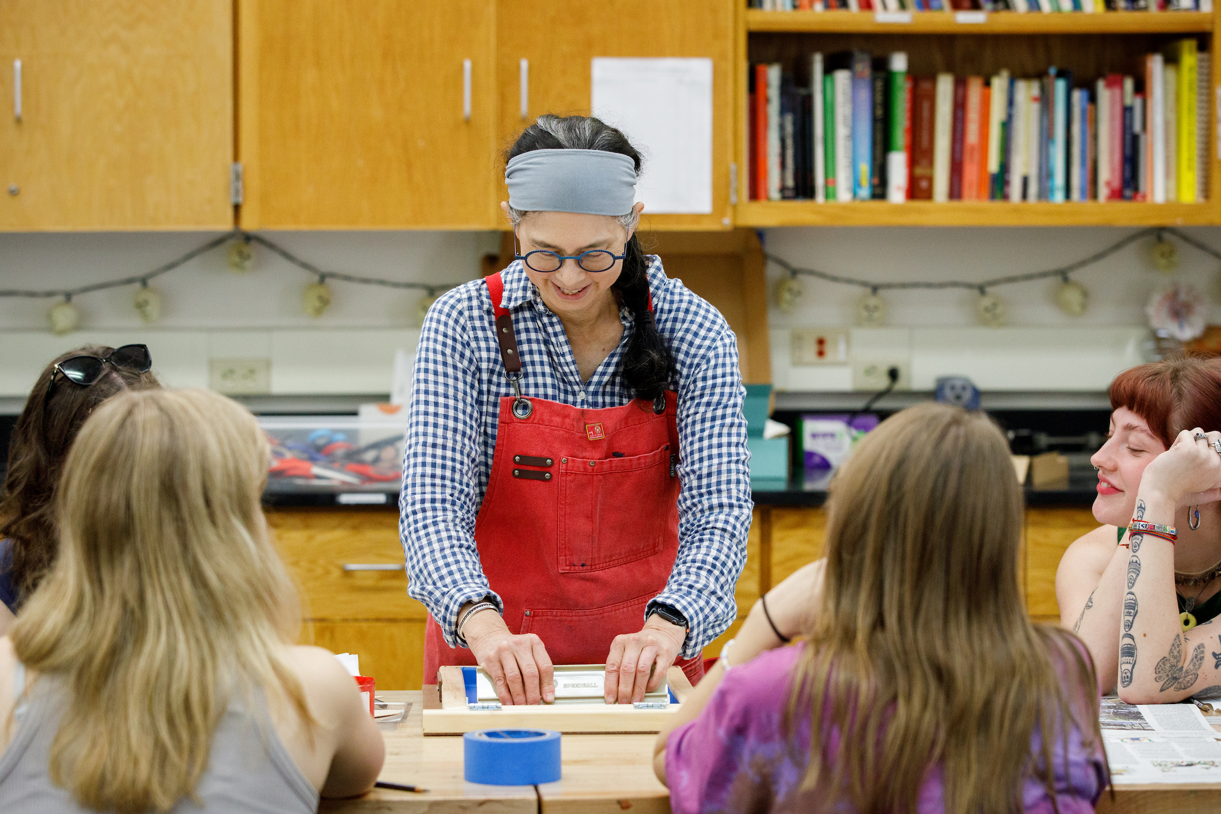 Midvale Elementary School art teacher Meri Lau provides a screenprinting demonstration to the students in the Art Education classroom of the Humanities Building at the University of Wisconsin–Madison.