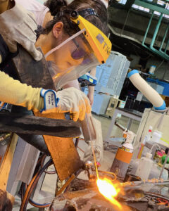 Photograph of Jocelyn Chan glassblowing at the Toyama Institute of Glass Art in Toyama, Japan.